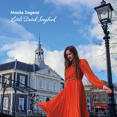 Front cover of Maaike's album Little Dutch Songbook: she's wearing an orange dress in front of a building in old Schiedam.